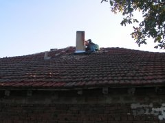 Removal of the leak by the chimney with new sheet metal flashing